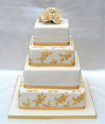 ivory_roses_and_gold_piped_embroidery.jpg