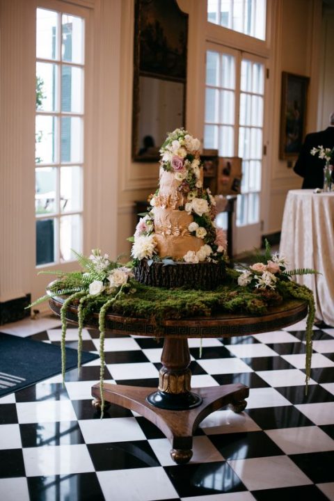 a-cake-table-covered-with-moss-and-florals-for-a-secret-garden-wedding-480x720.jpg
